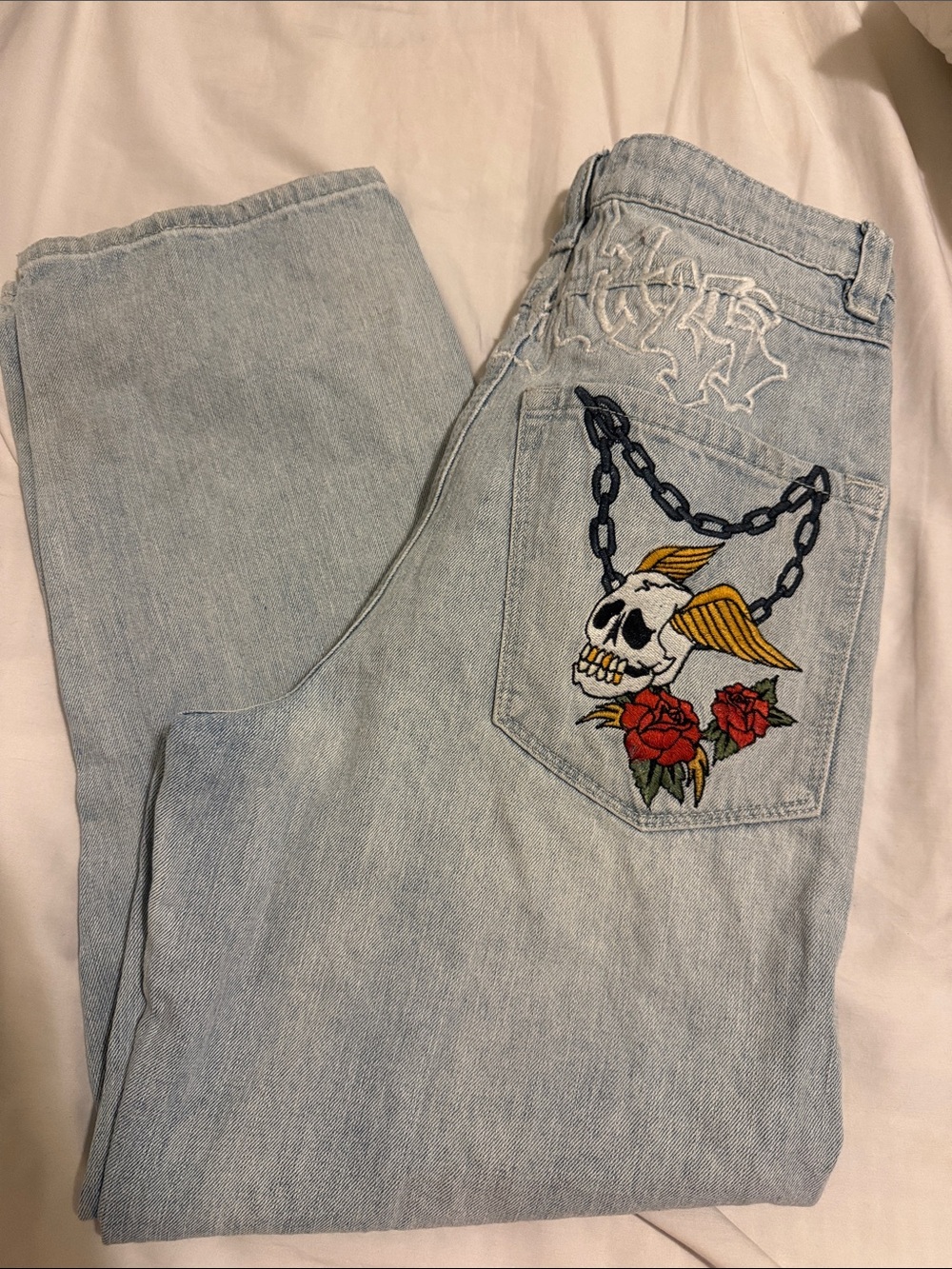 Ambush Light Wash Jeans with Embroidered Skull, Wings & Roses